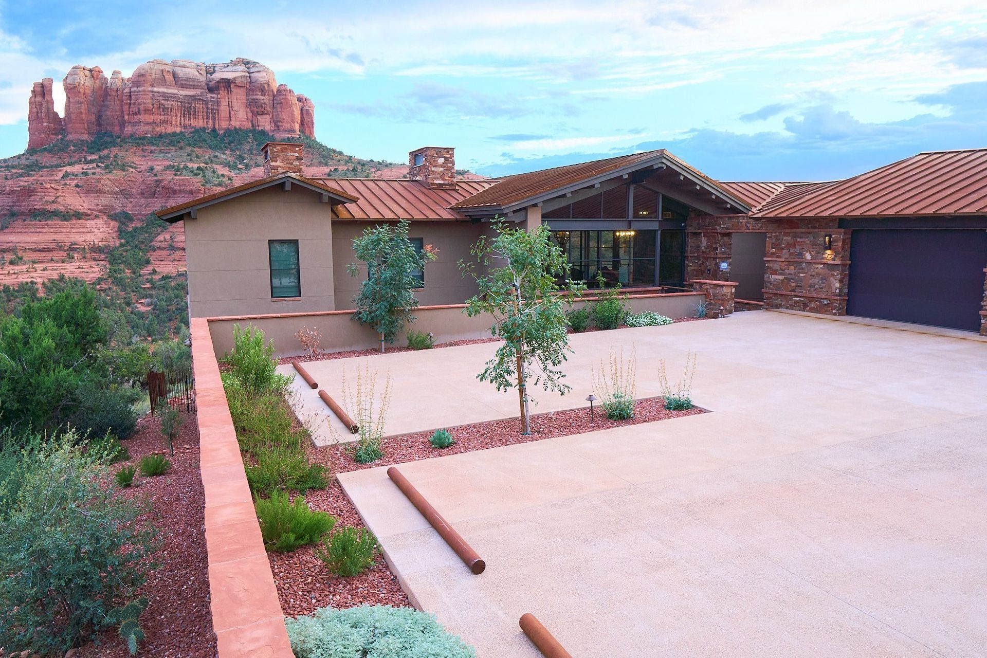 A large house with a mountain in the background