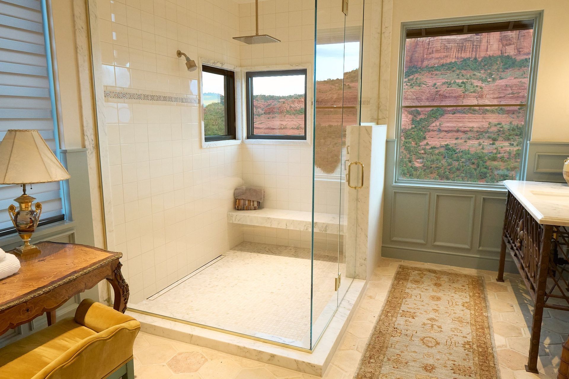 A bathroom with a walk in shower and a window