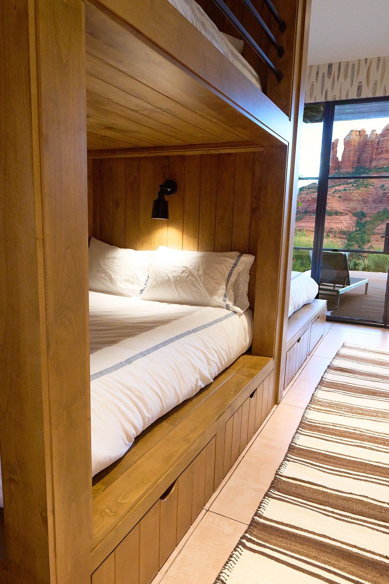 There is a bunk bed in the middle of the room.