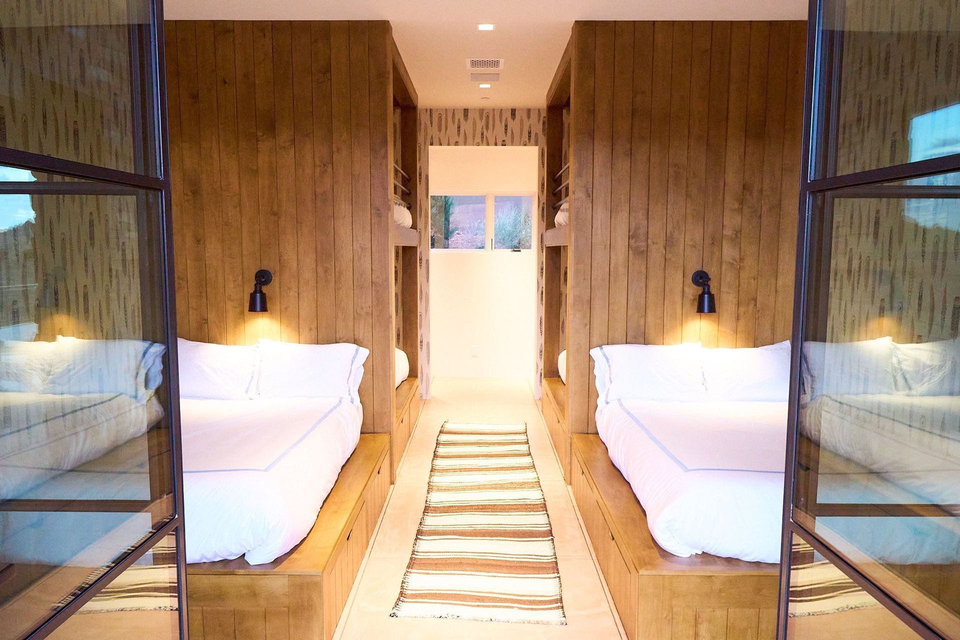 A bedroom with two beds and a couch in it