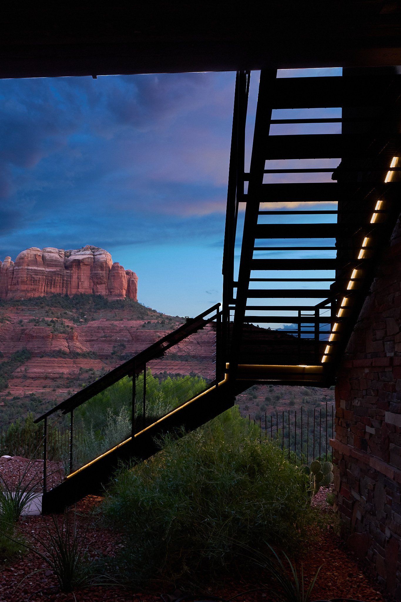 A staircase with a view of a mountain in the background.