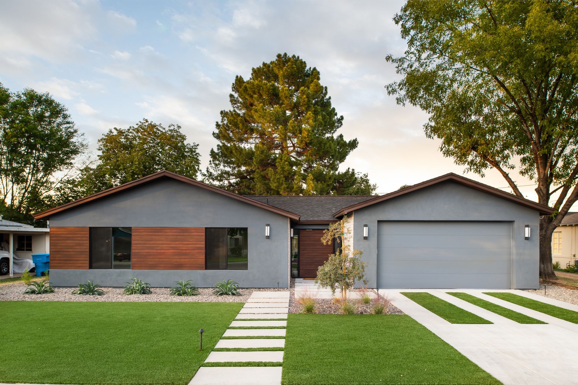 A house with a concrete walkway leading to it