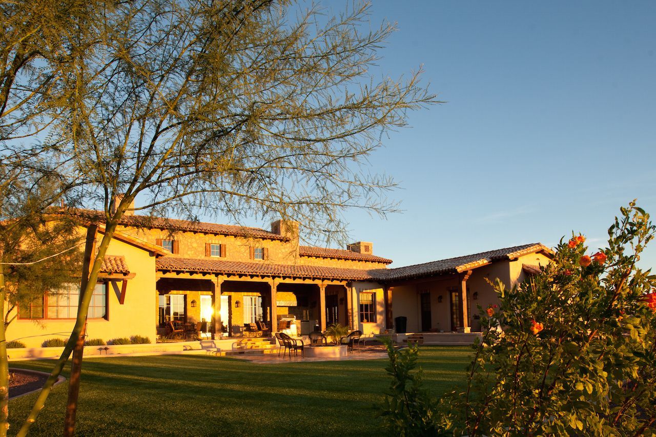 A large house with a large lawn in front of it