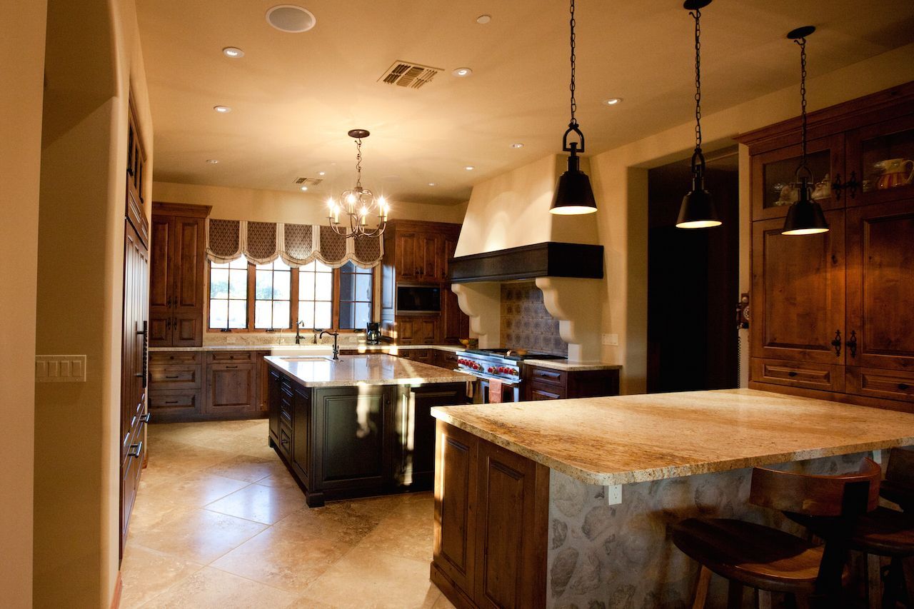 A large kitchen with a large island in the middle