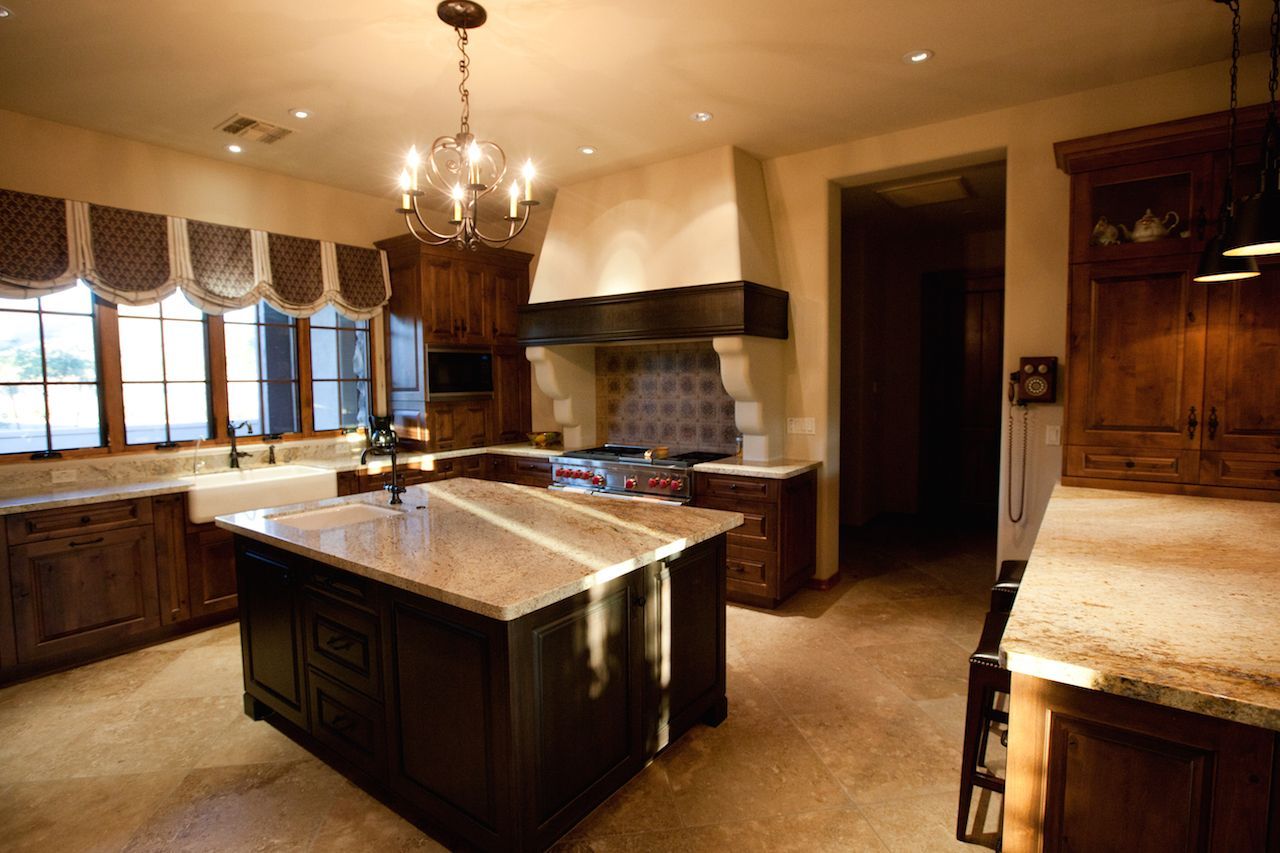 A kitchen with a large island in the middle