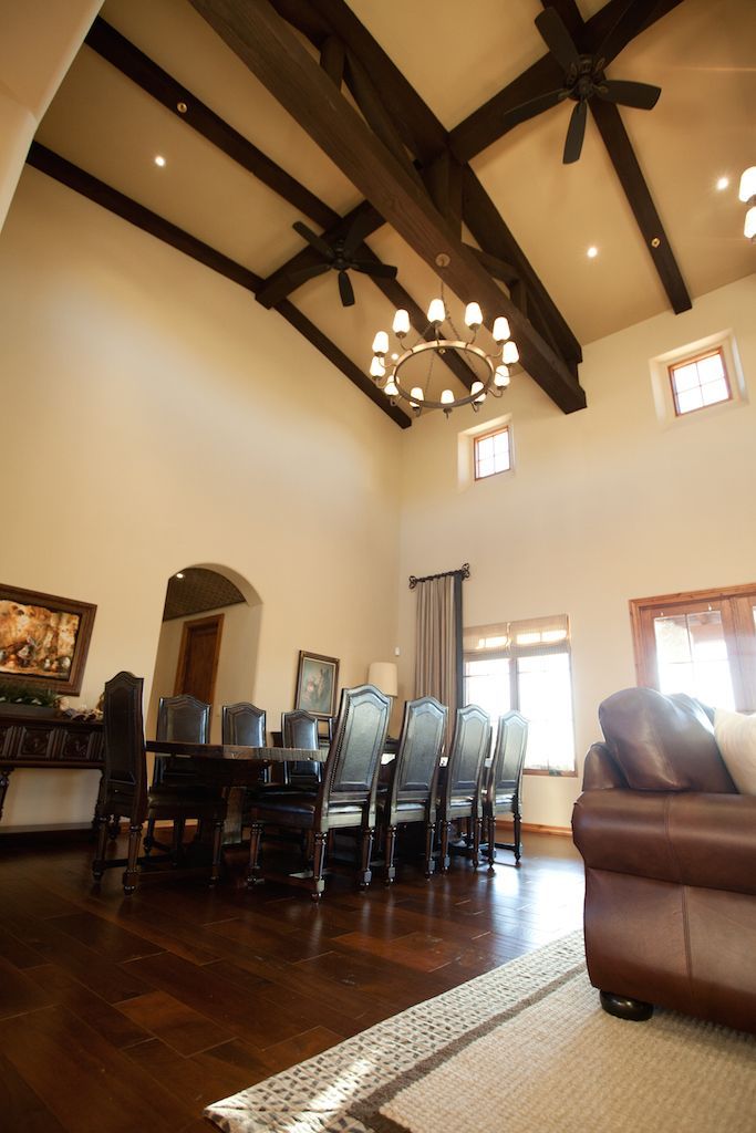 A living room with a dining room table and chairs