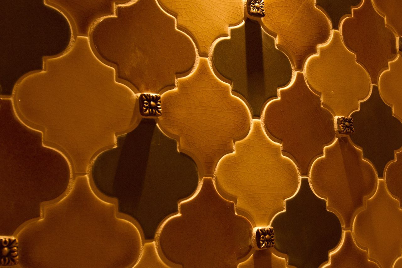 A close up of a wall with a geometric pattern