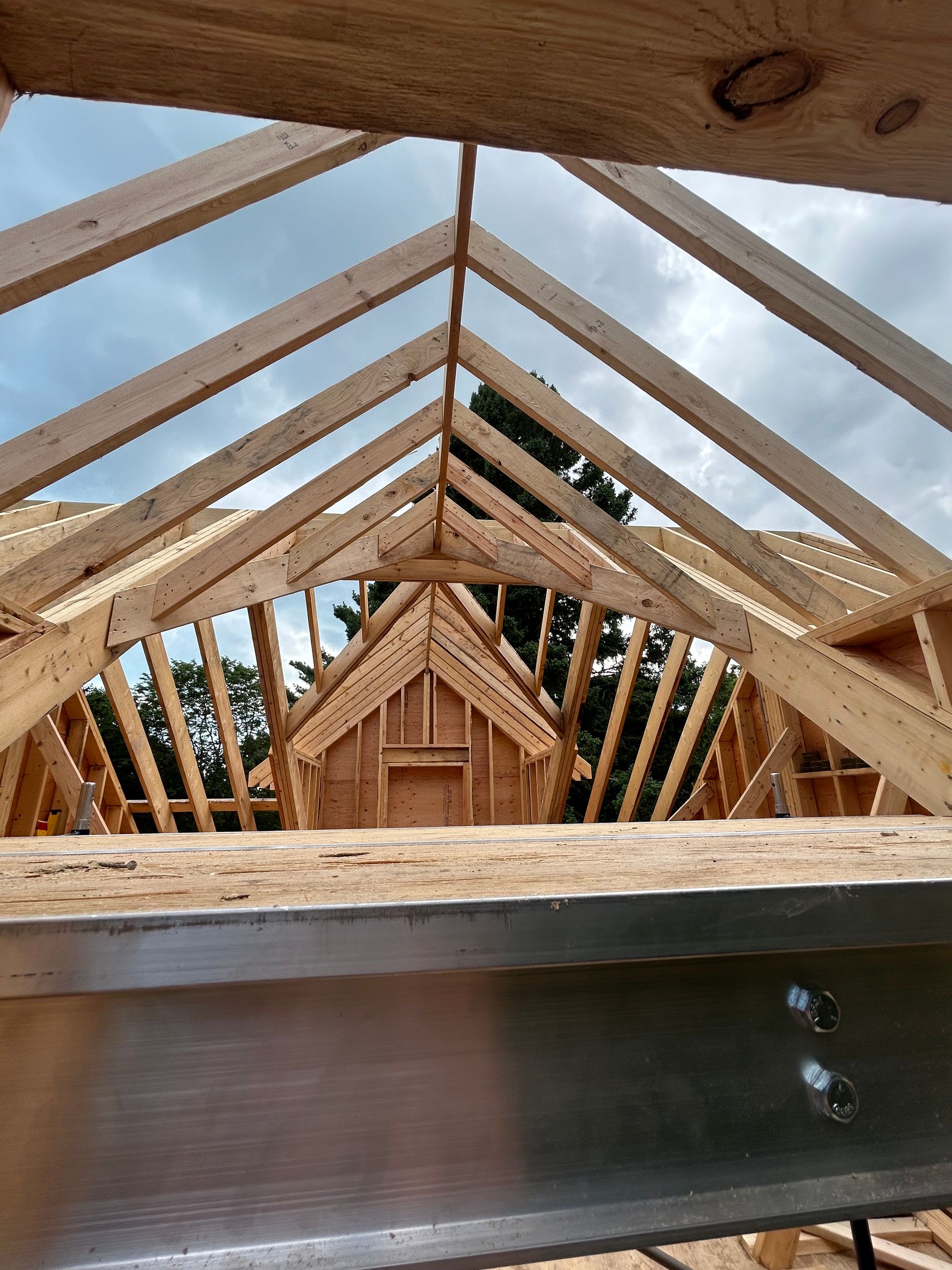 Looking up at the roof of a house under construction