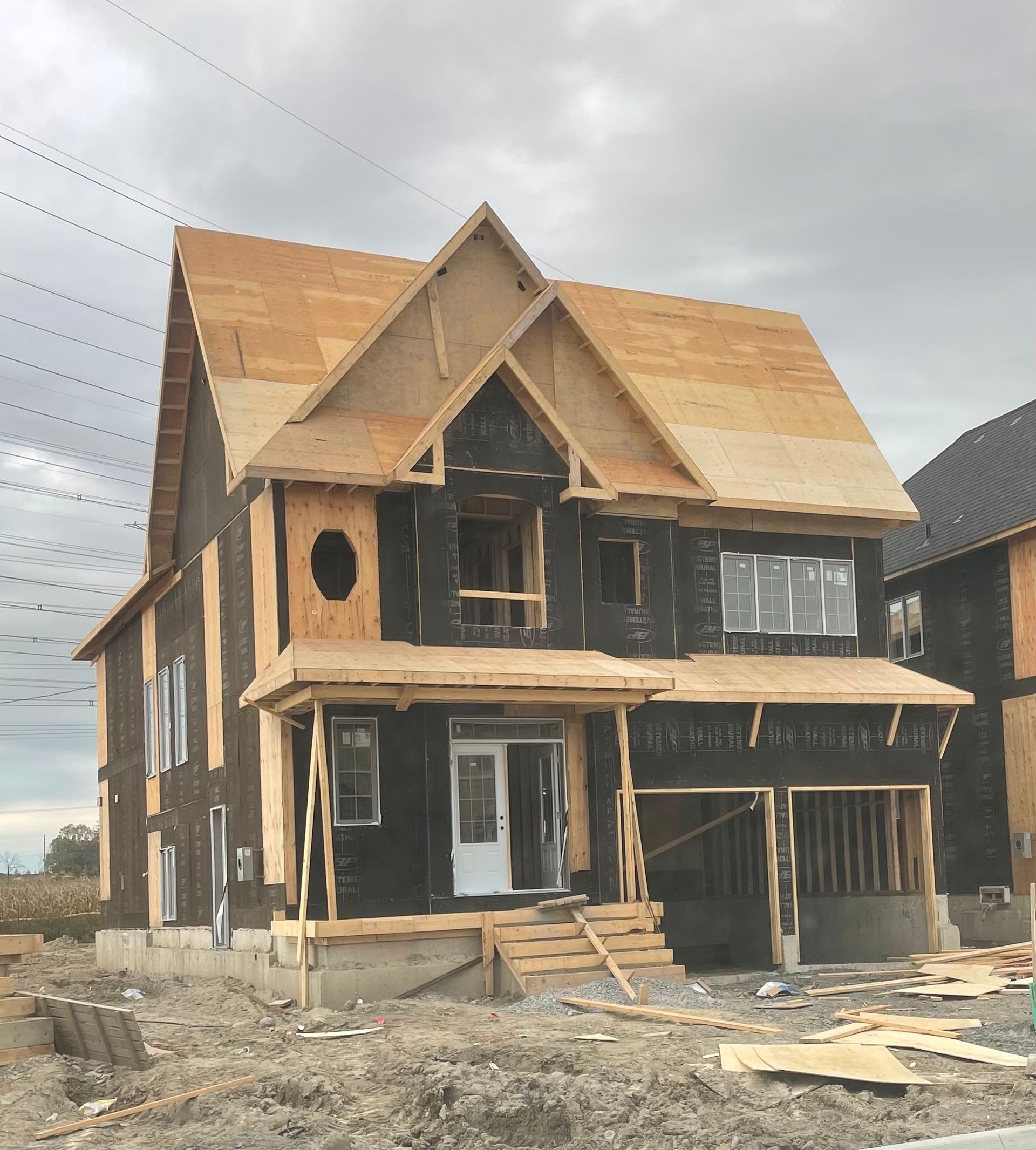A house under construction with a wooden roof