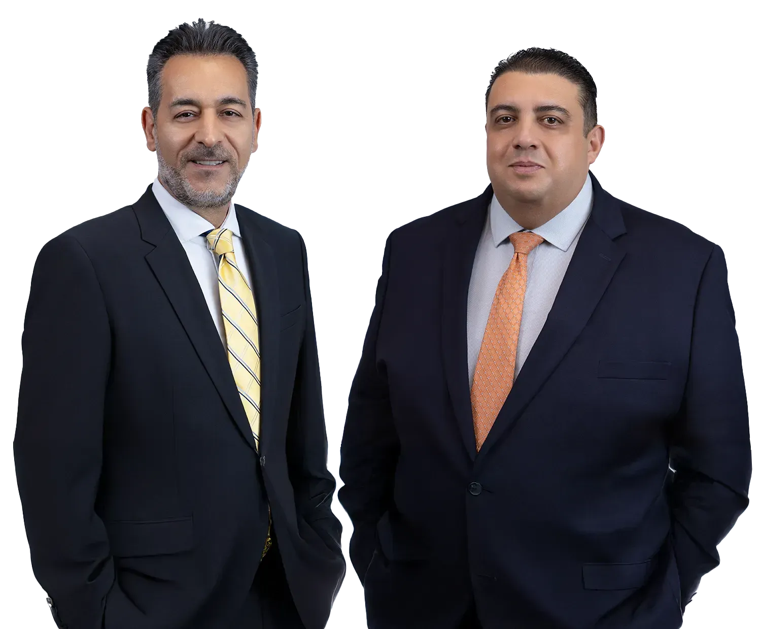 Two men in suits, one with yellow striped tie, other with orange tie, smiling, indoors.