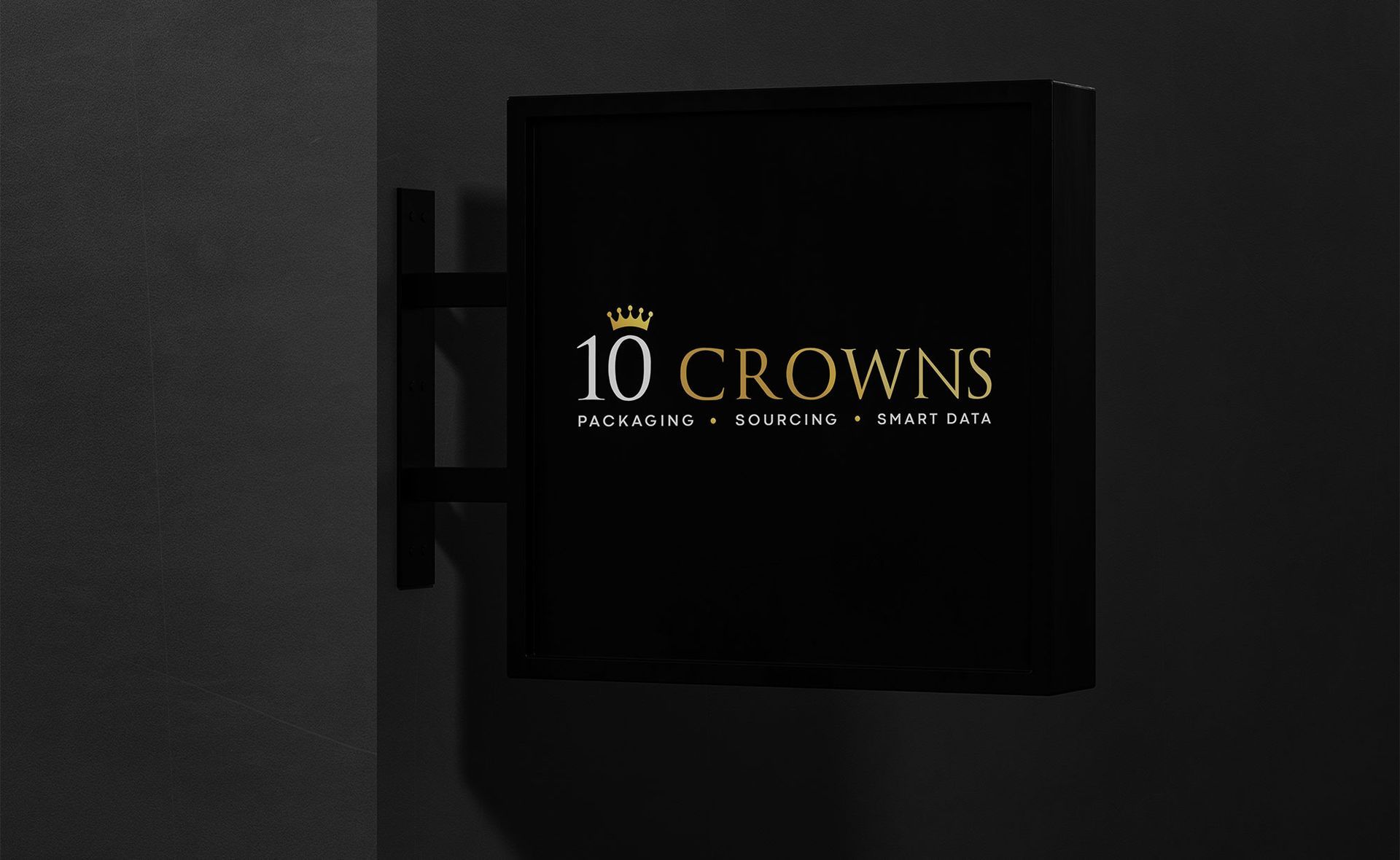 a black sign that with the 10 Crowns business logo