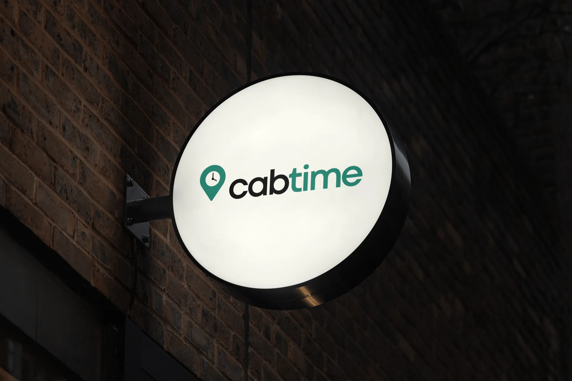 a CabTime sign hangs on a brick wall