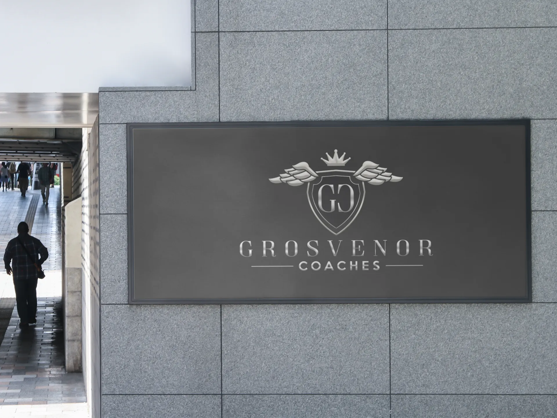 Grosvenor Coaches sign on a wall outside