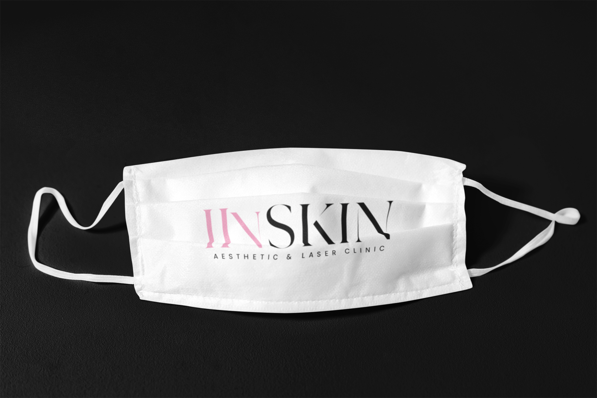 a white iinSkin clinic face mask