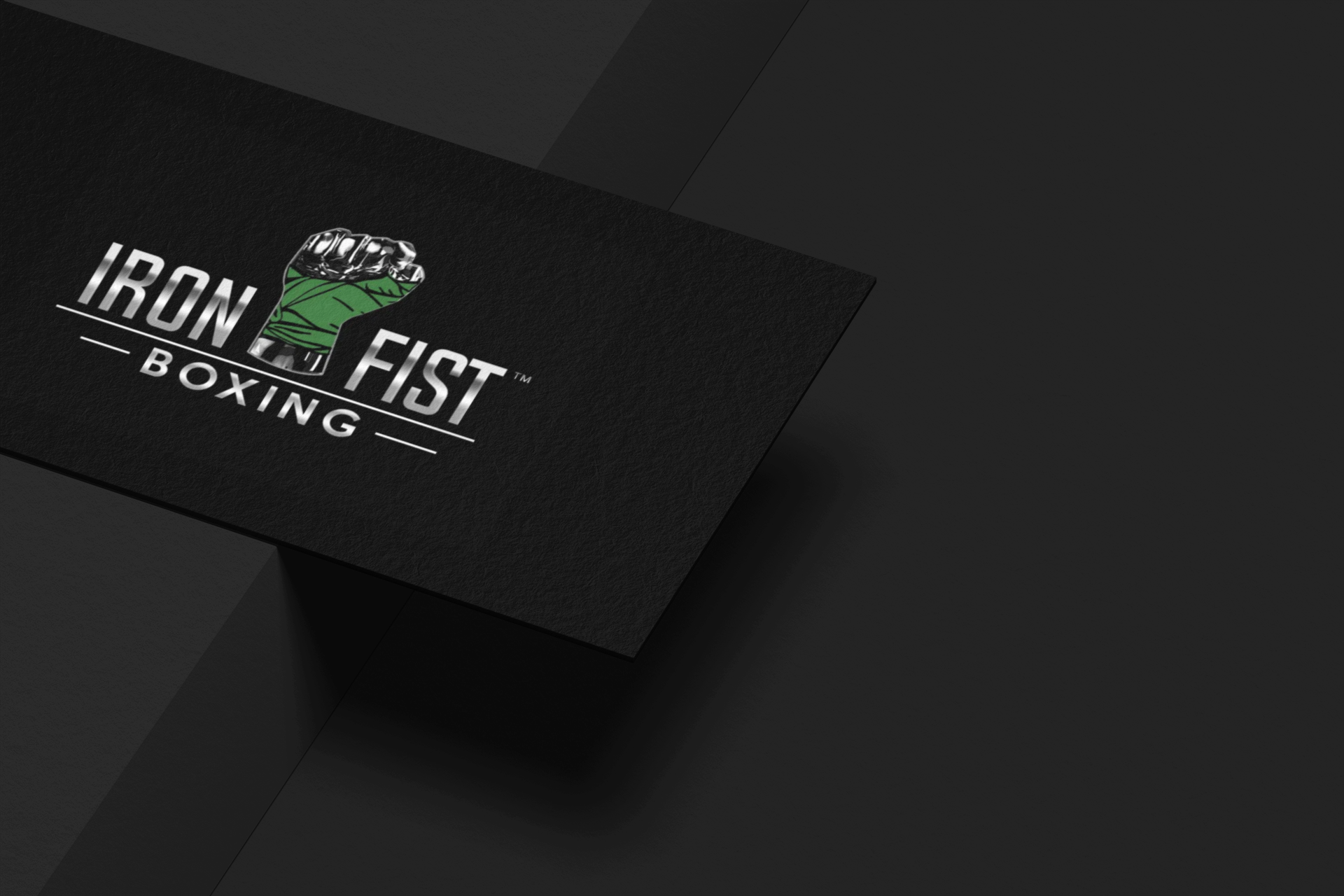 a black business card for iron fist boxing