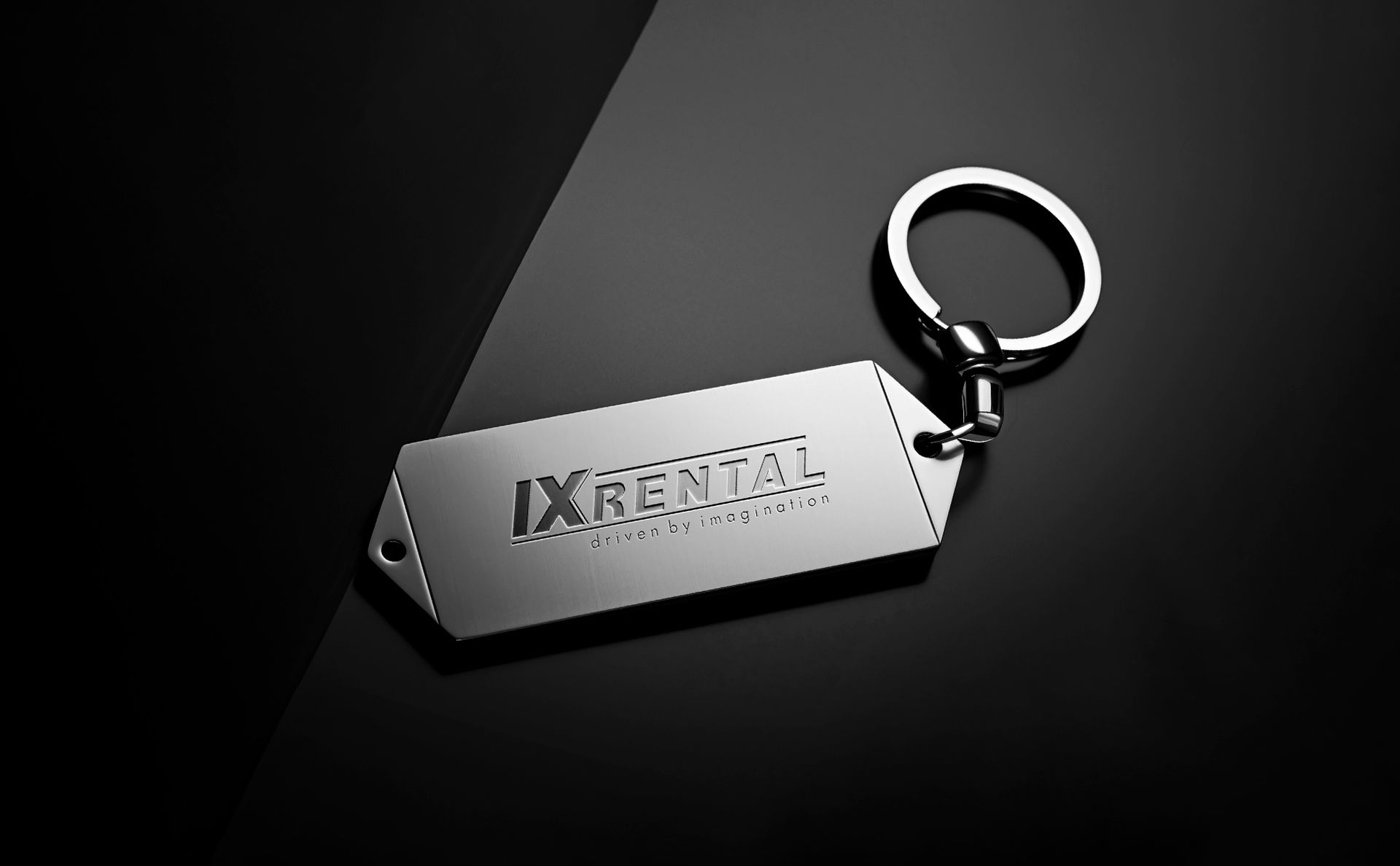 A IX Rental keychain wth the IX Rental logo printed on it