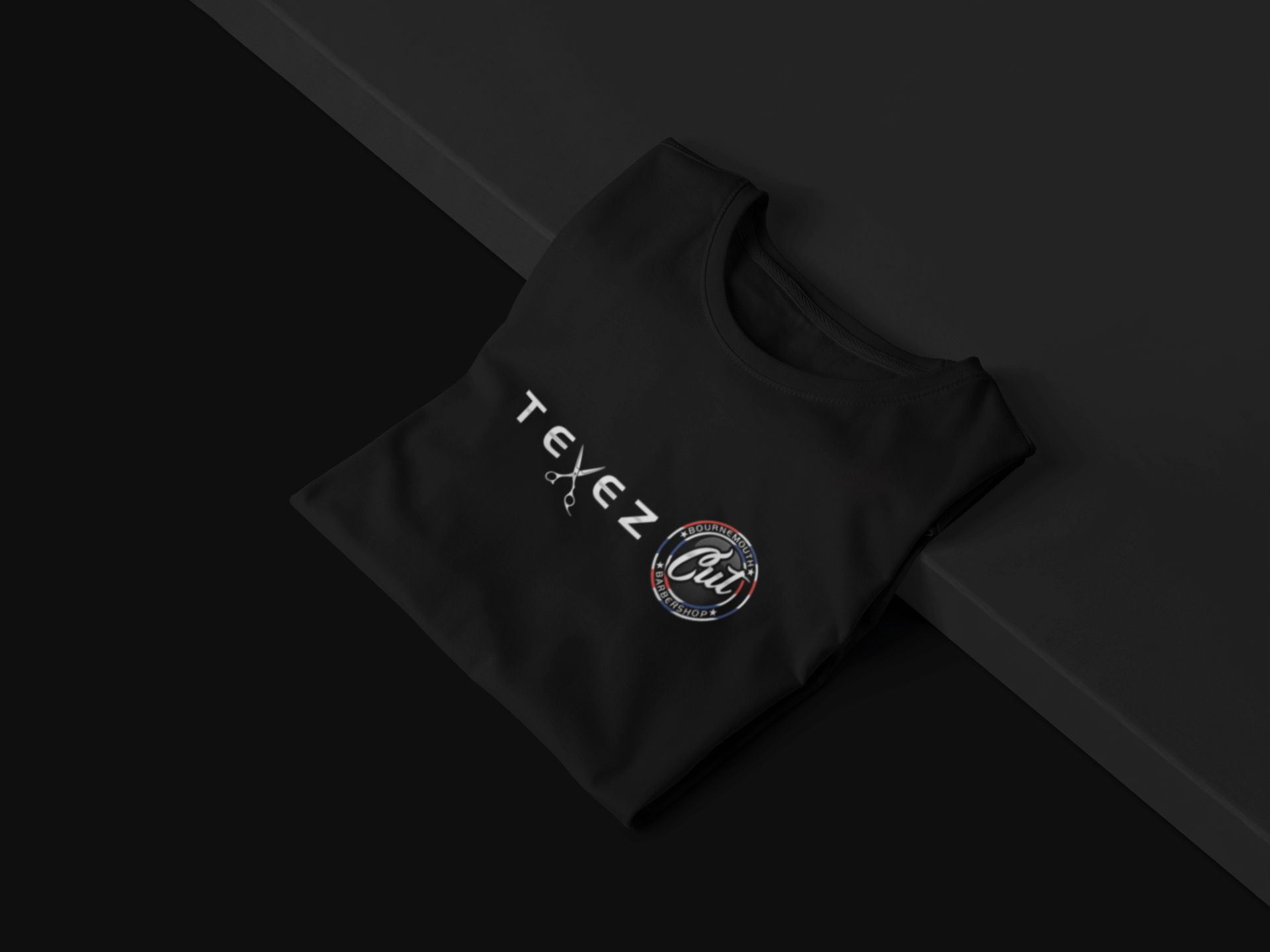A black Tevez Cut logo t-shirt folded