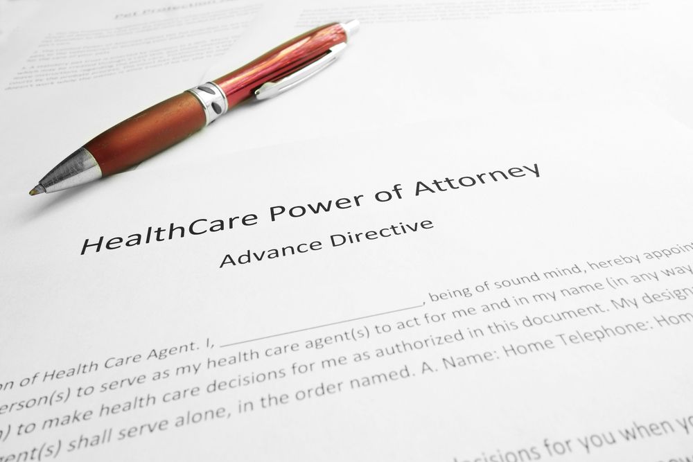 A pen is sitting on top of a healthcare power of attorney