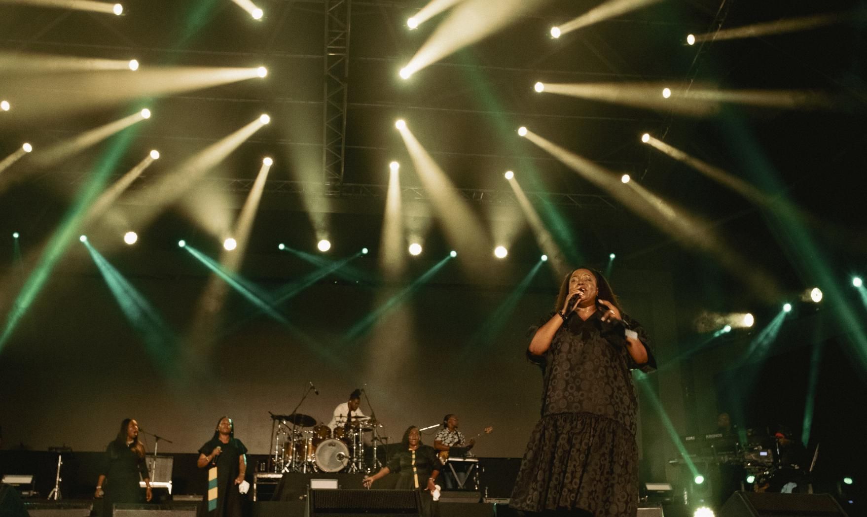  Chevelle performs on stage with band, lit by green and white spotlights.