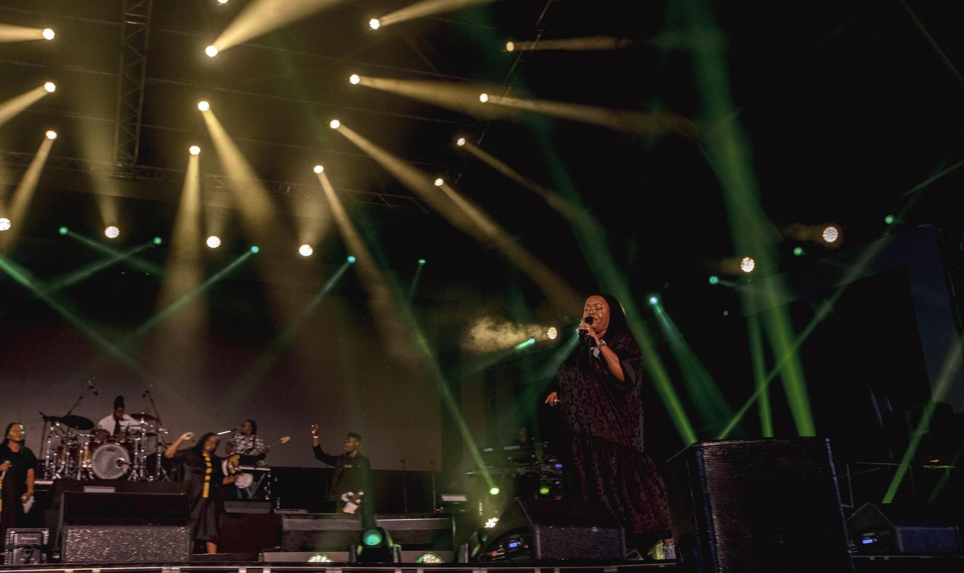  Chevelle performs on stage with band, lit by spotlights.