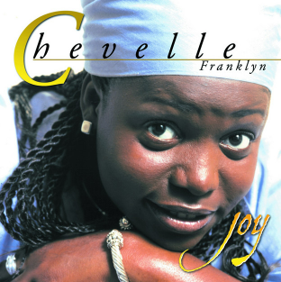 Chevelle Franklyn album cover. Woman in blue, braids, smiling; title 