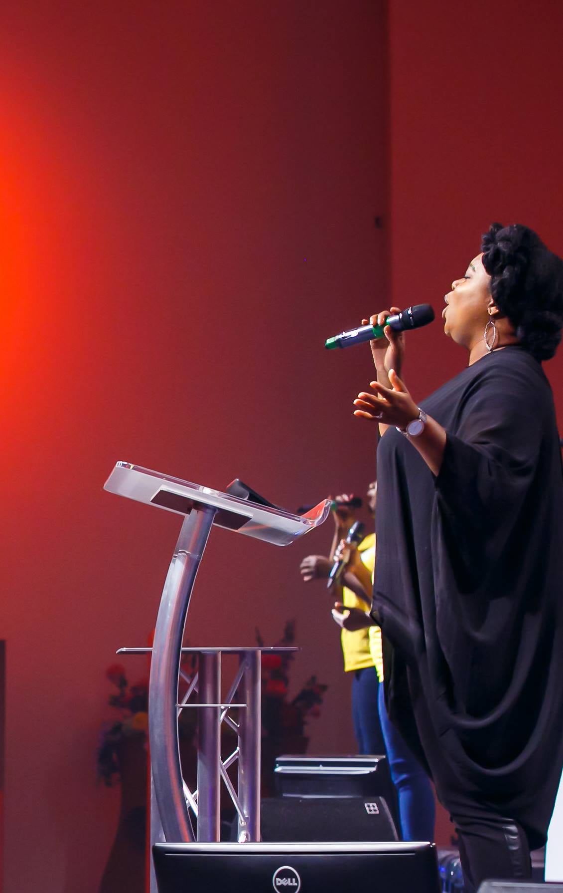  Chevelle singing into a microphone on stage.