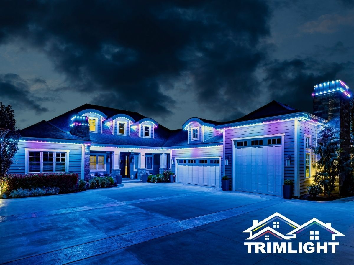 House exterior lit with blue and purple Trimlight LEDs.