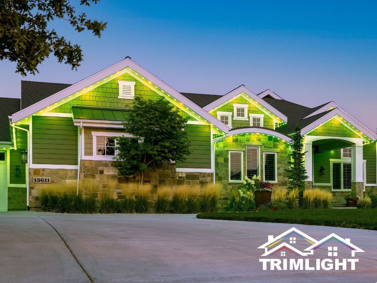 Green house illuminated with green lights, blue sky.