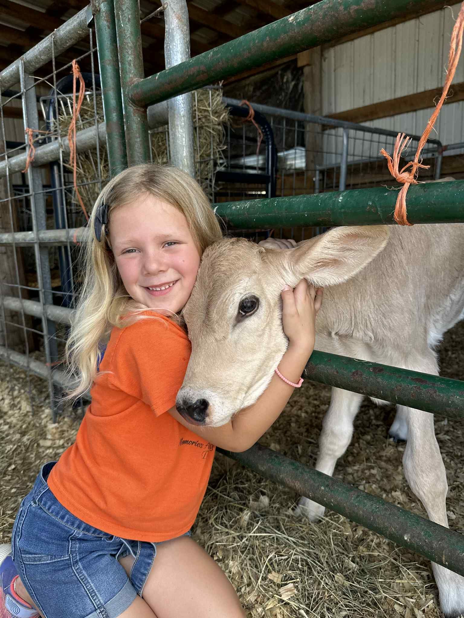 Girl feeding a goat — Dry Ridge, KY — Country Pumpkins