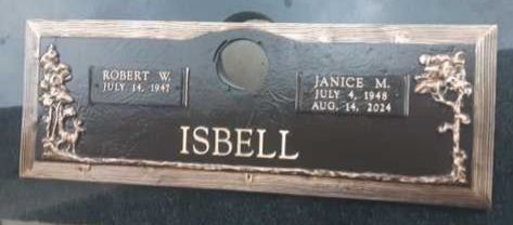 Black headstone with the name