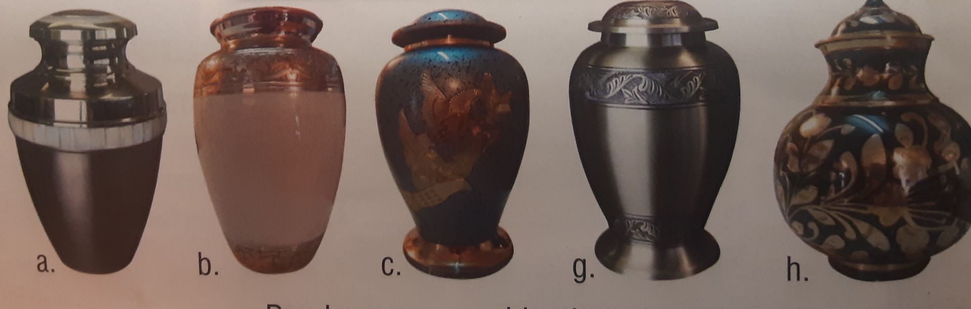 Urn on a wreath at a funeral; mourners in the background.