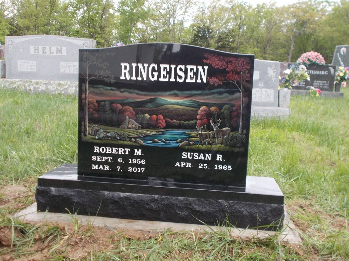 Black tombstone with painted landscape, names Ringeisen, dates Sept. 6, 1946 - Mar. 7, 2007 and Apr. 28, 1948.