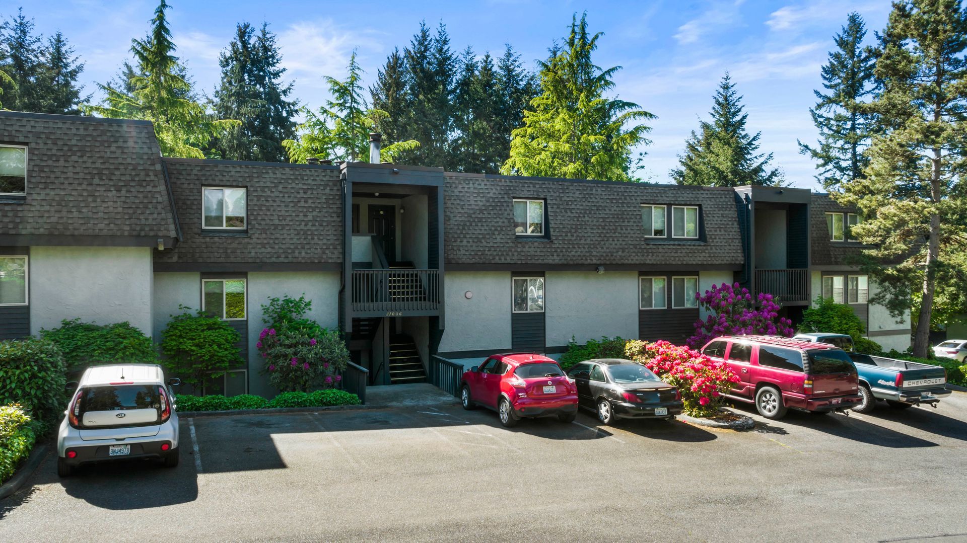 a building with a lot of cars parked in front of it