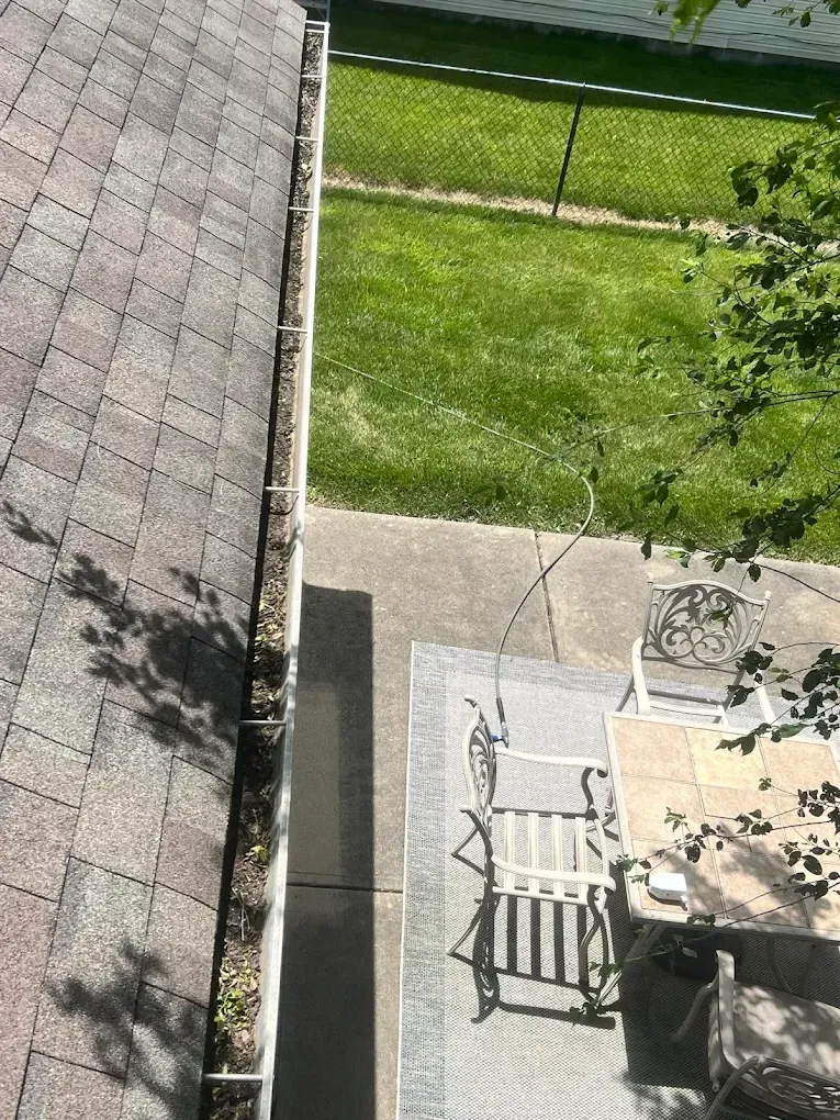 An aerial view of a gutter on the side of a house.