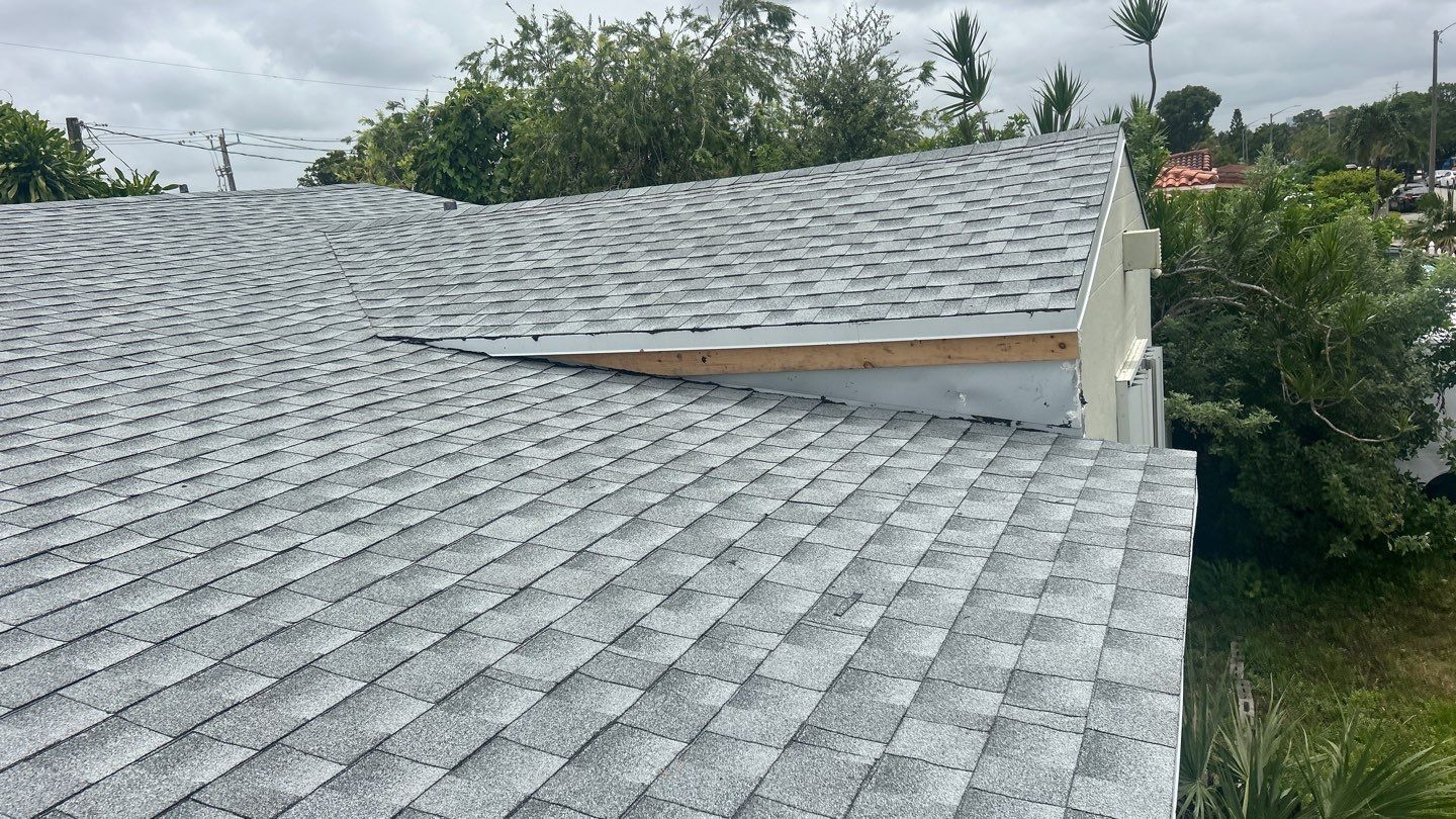 Completed asphalt shingle roof installation by Prestige Windows & Doors