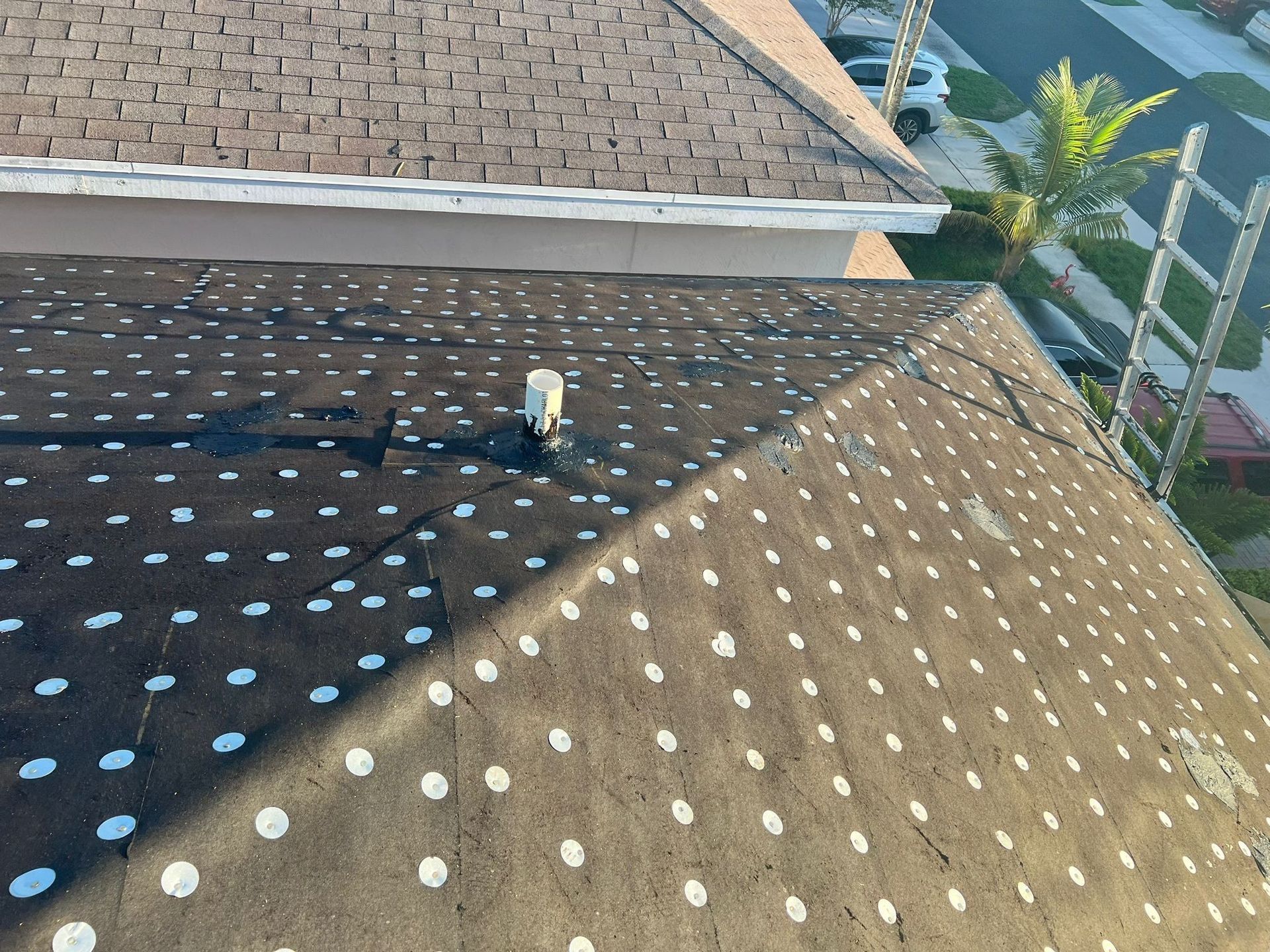 Professional roof replacement in progress by Prestige Windows & Doors