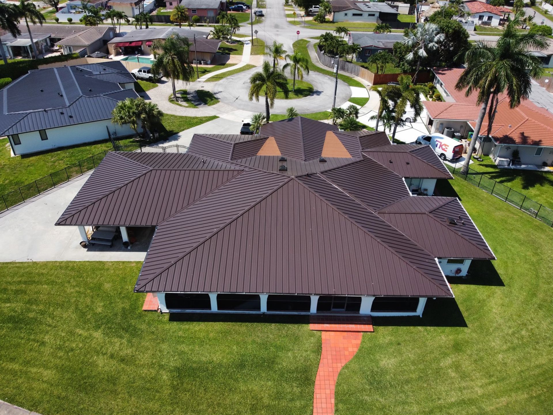 Front view of newly installed metal roof by Prestige Windows & Doors