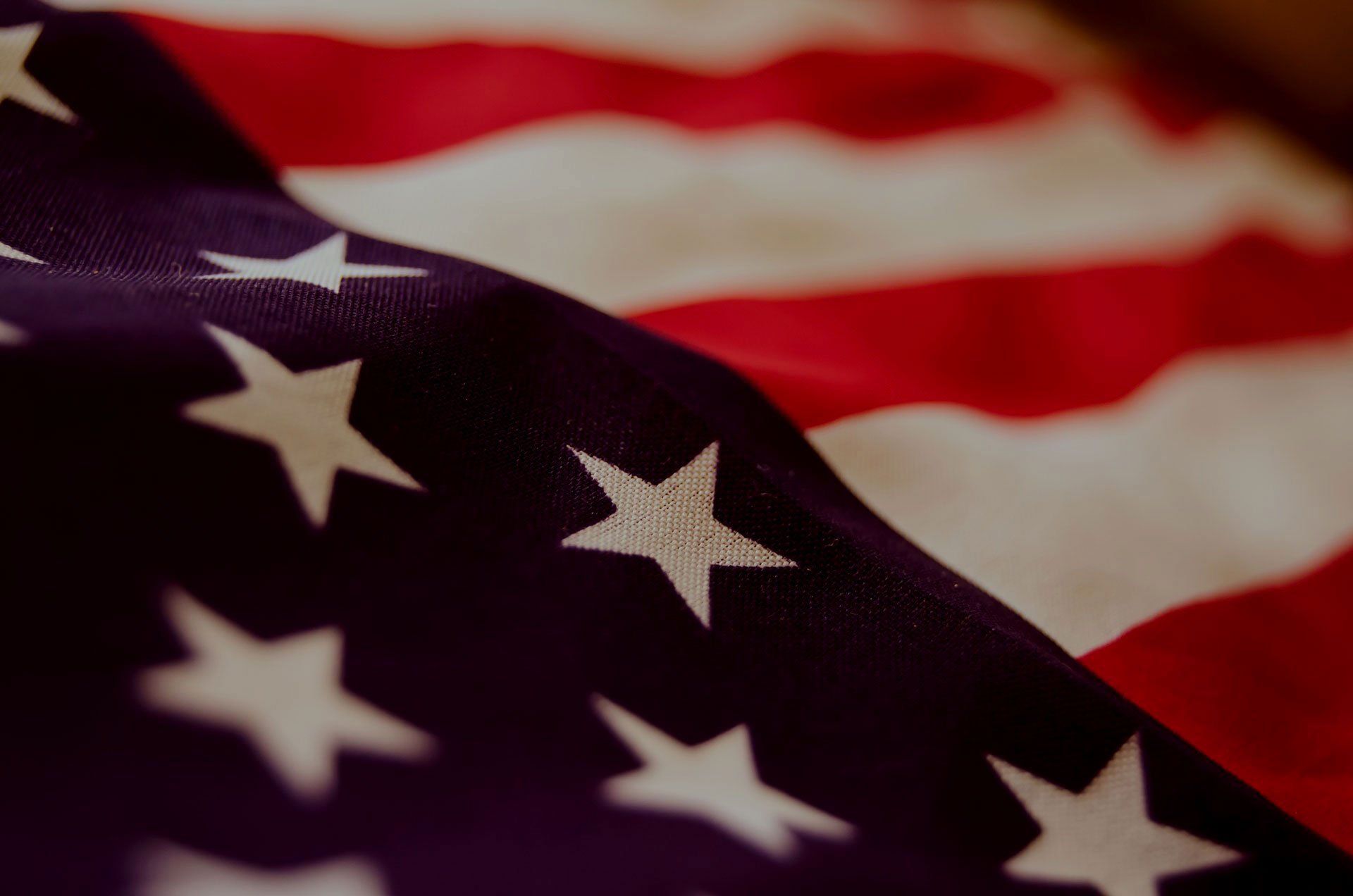 A close up of an american flag with stars on it
