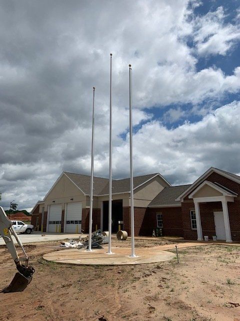 A house with three flags in front of it