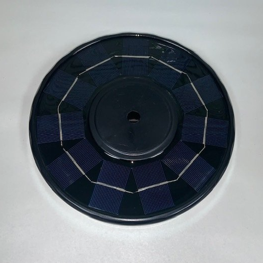 A black disc with a hole in the middle of it