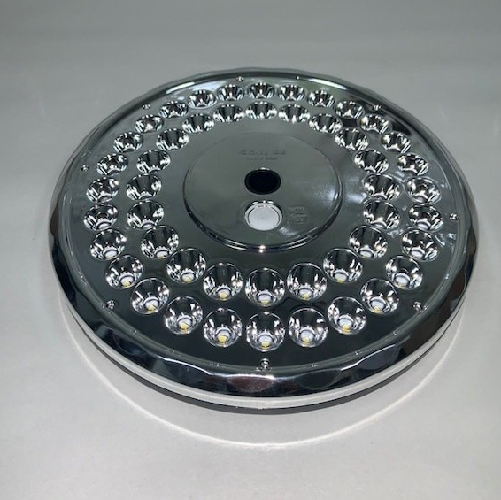 A chrome plate with a hole in the middle of it