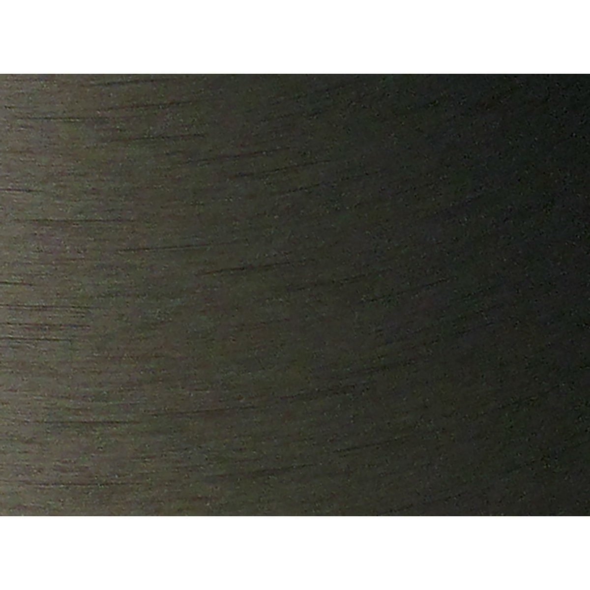 A close up of a black metal surface on a white background.