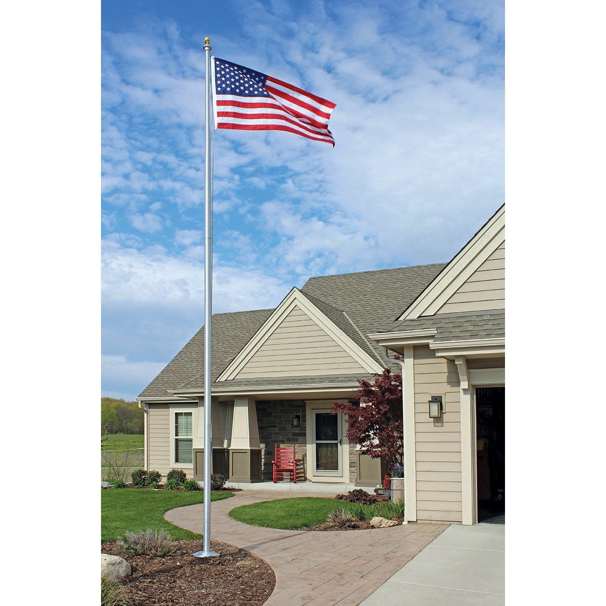 An american flag is flying in front of a house