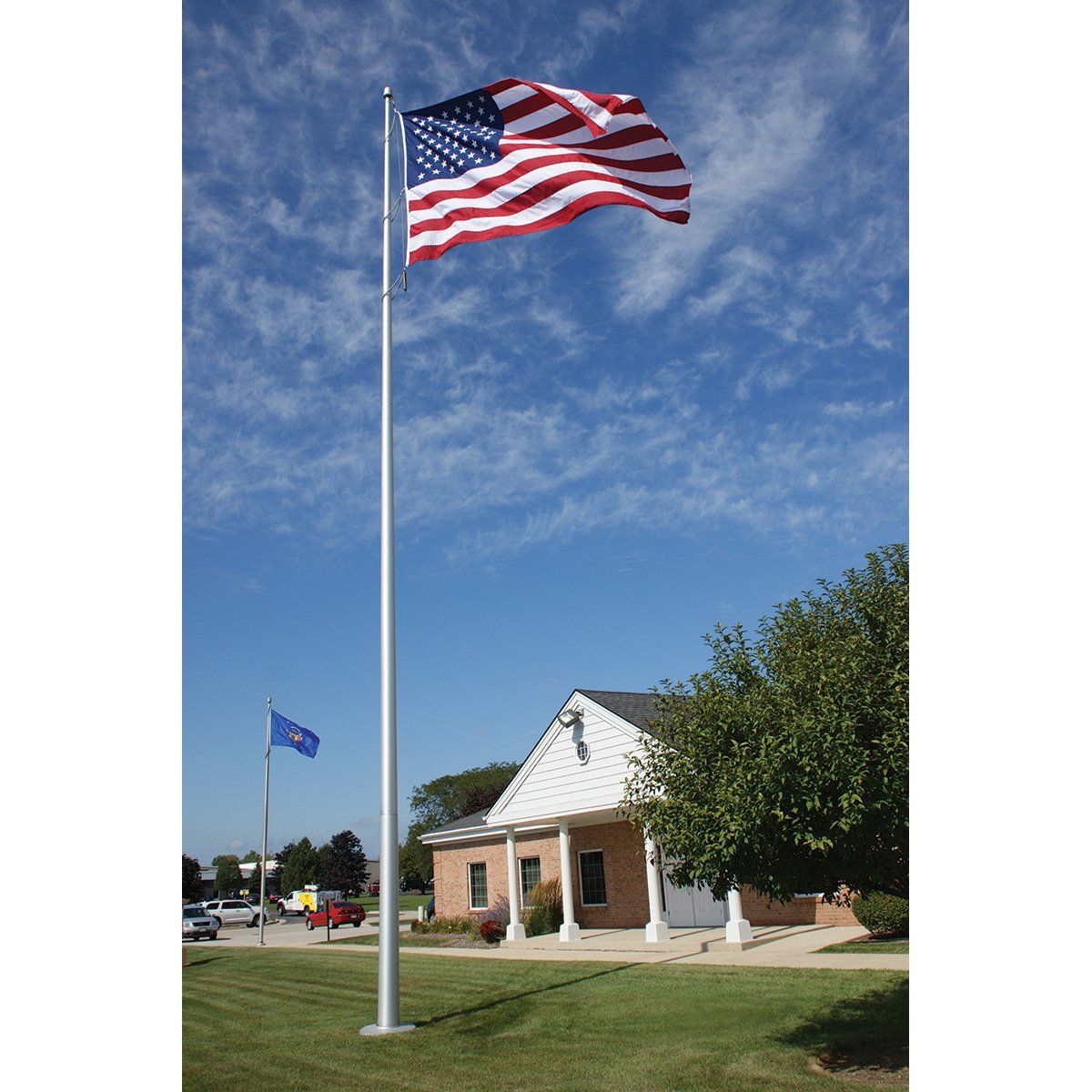 An american flag is flying in front of a house