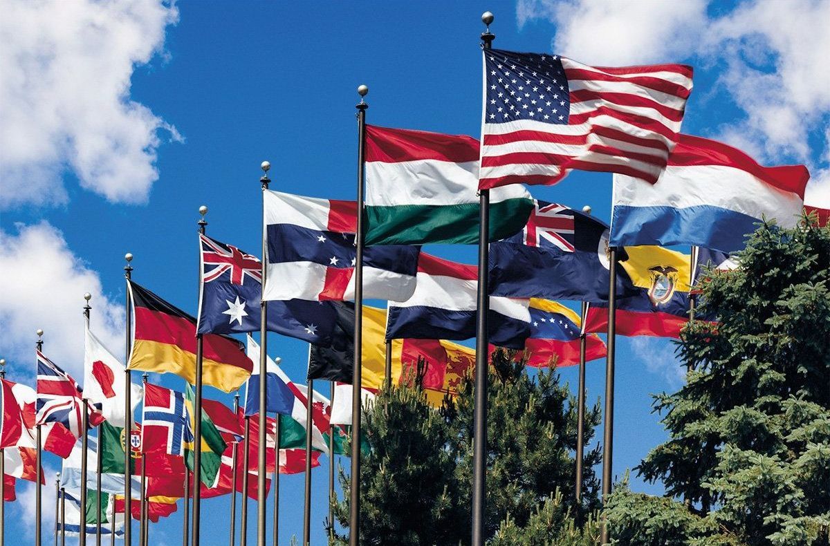 Large arrangement of world flags on flagpoles