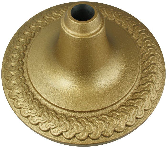 A gold plate with a hole in the middle
