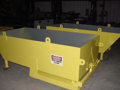 A yellow bin with a danger sign on it