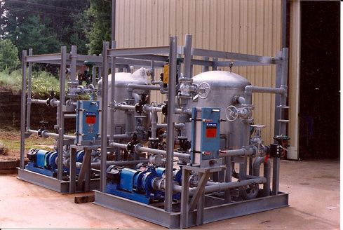 A bunch of pipes are lined up in front of a building