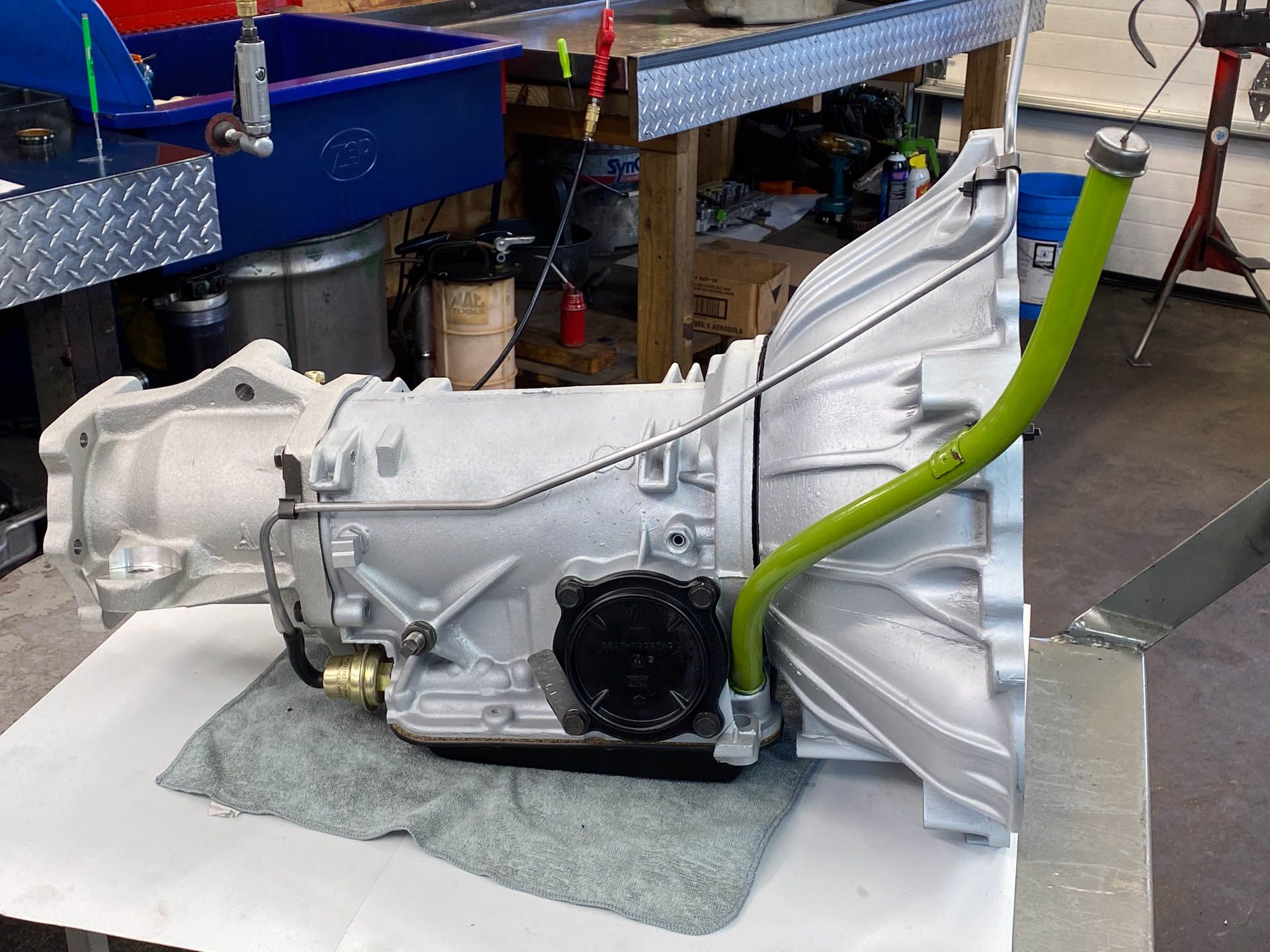 A gearbox with a green pipe attached to it