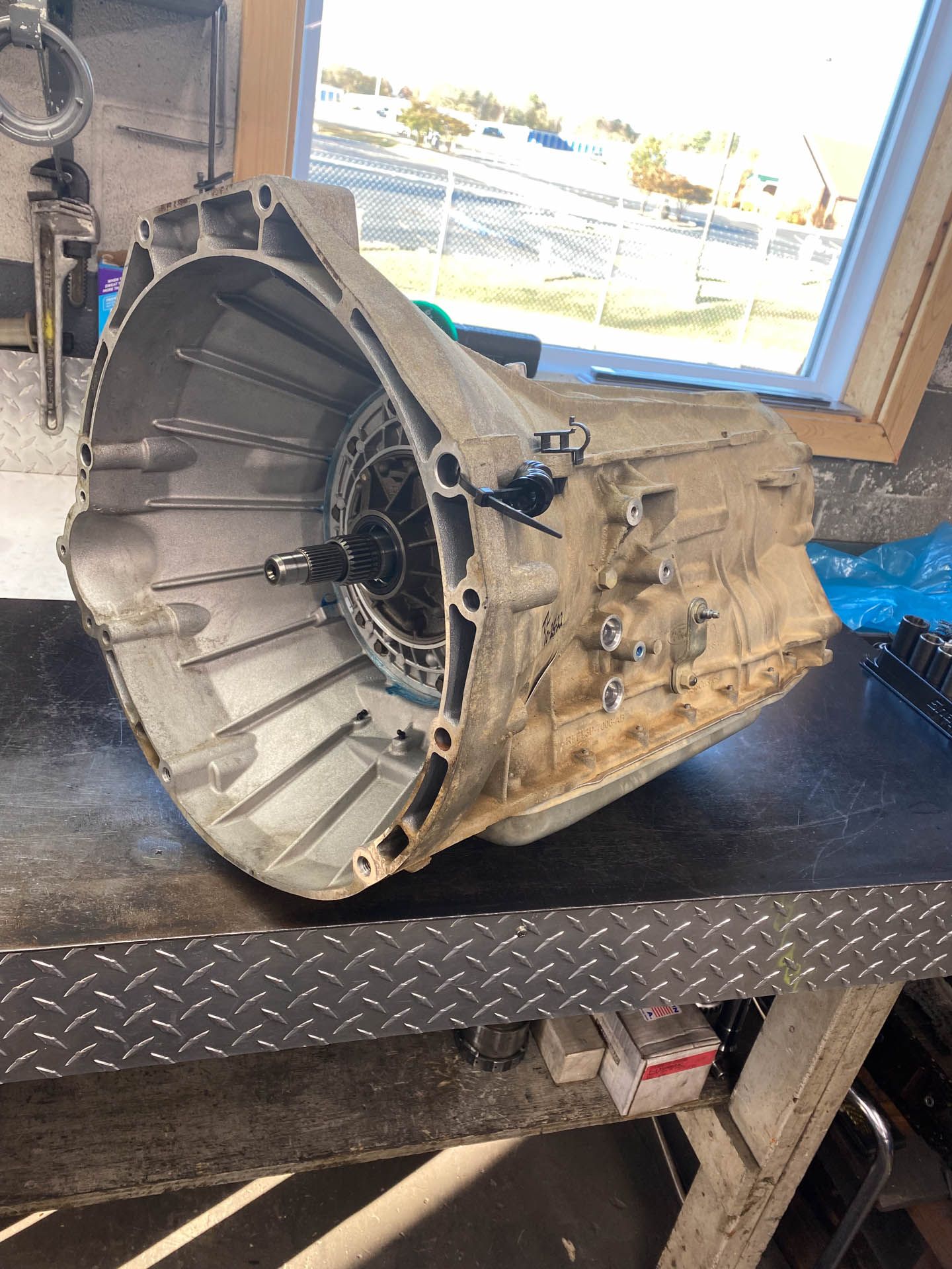 A gearbox is sitting on top of a metal table.